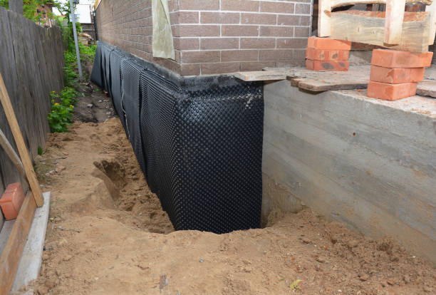SJ Waterproofing Pros technician performing targeted Basement Waterproofing assessment in Roann, IN